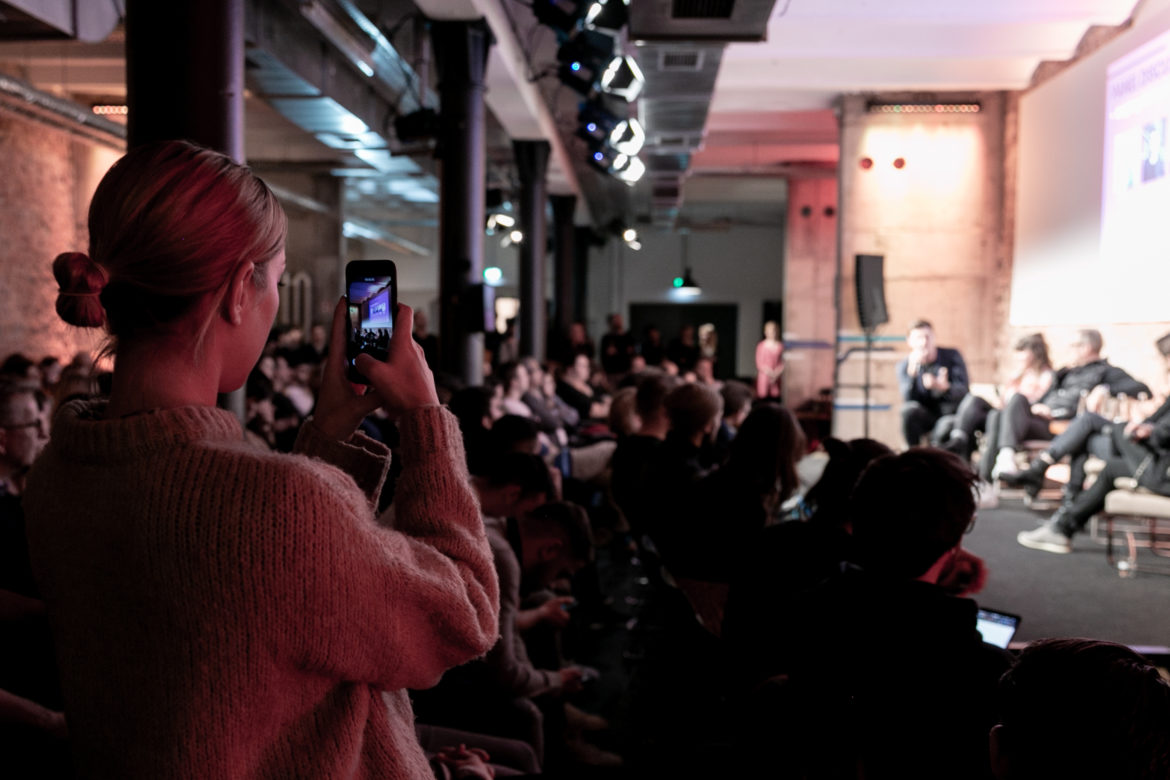 A photo of someone livestreaming a Factory Berlin Fireside Chat online.