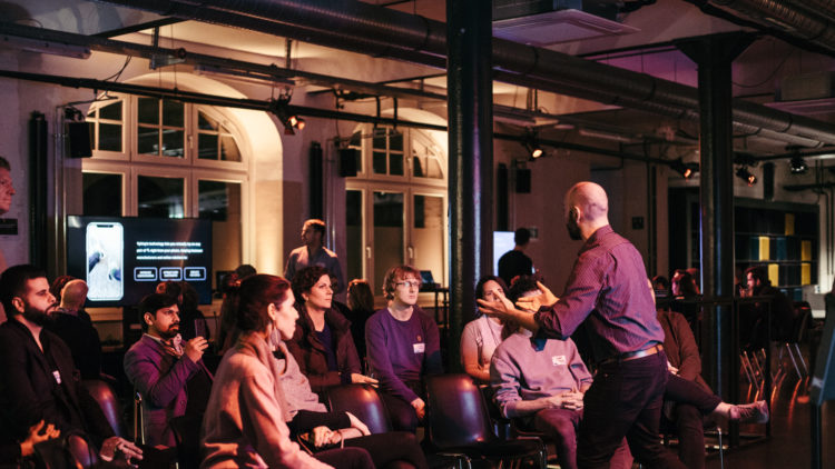 Community audience and speakers at our Futures Forum corporate event format.