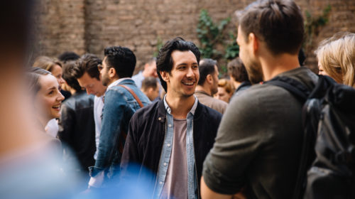 Student members at Factory Berlin socialising at a community event.