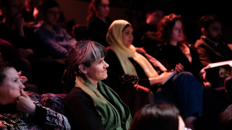 A guest in the audience asks a question at Factory Berlin Masterclass.