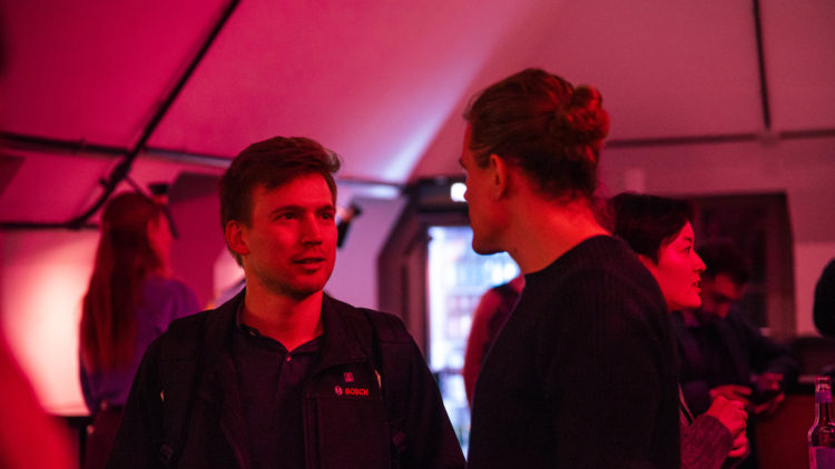 A photo of Factory Berlin members networking at a Circle event.